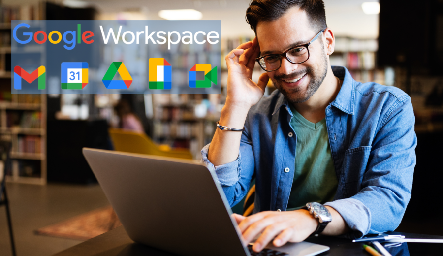 Man working on a laptop with the Google Workspace logos to his left